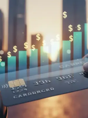 Credit card with rising debt graph, symbolizing high consumer credit card debt